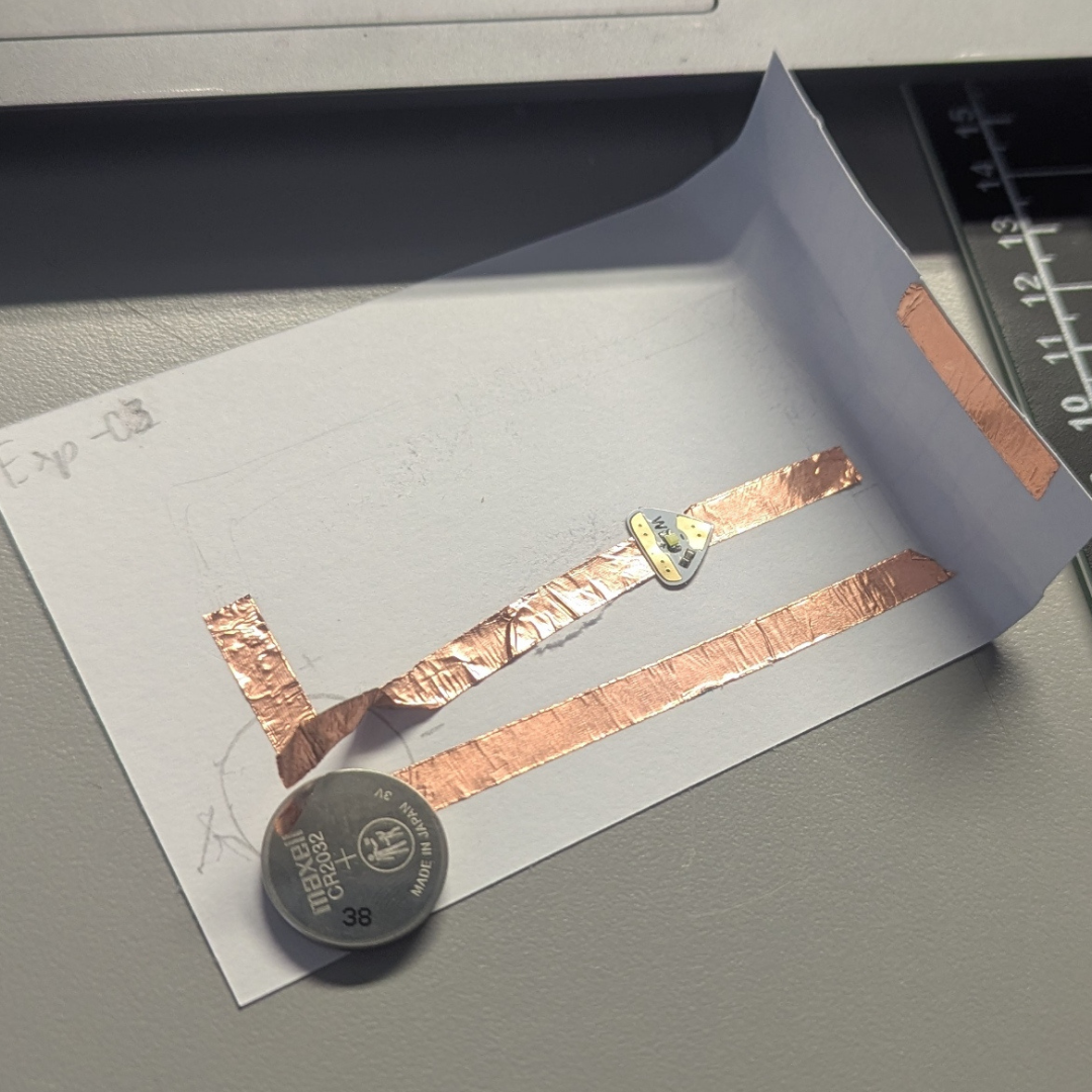 I'm thinking maybe the curving or something caused an issue—maybe the electricity was lost. So, I remade the lines simpler but kept the switch part. Even after that, the LED light never flashed or turned on at all.